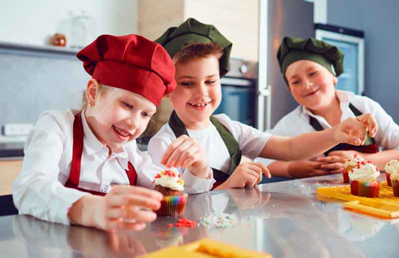 10-year-olds decorating cupcakes