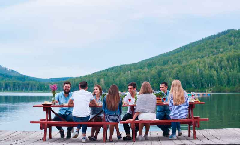 Friends at a picnic by the lake