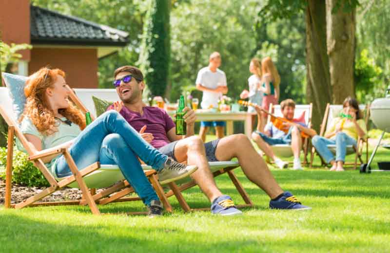 Friends relaxing in their backyard