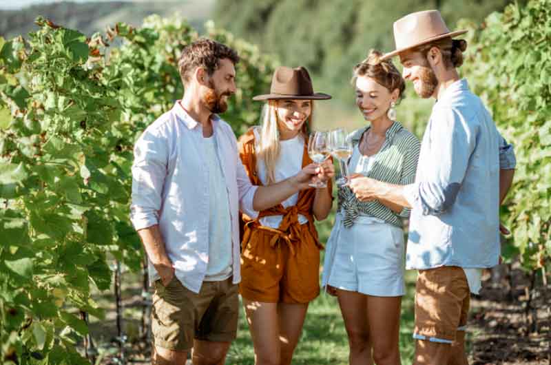 People tasting wine at a vineyard