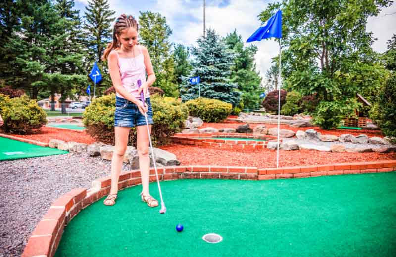 Teenager Mini Golfing