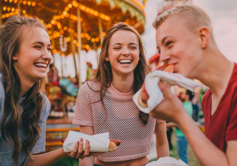 Teens Eating Hot Dogs