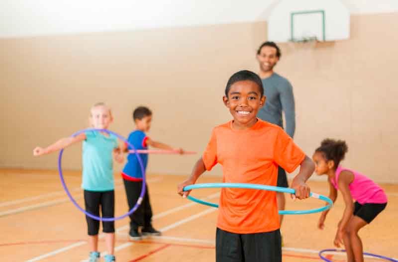 Teens Using Hula-Hoops