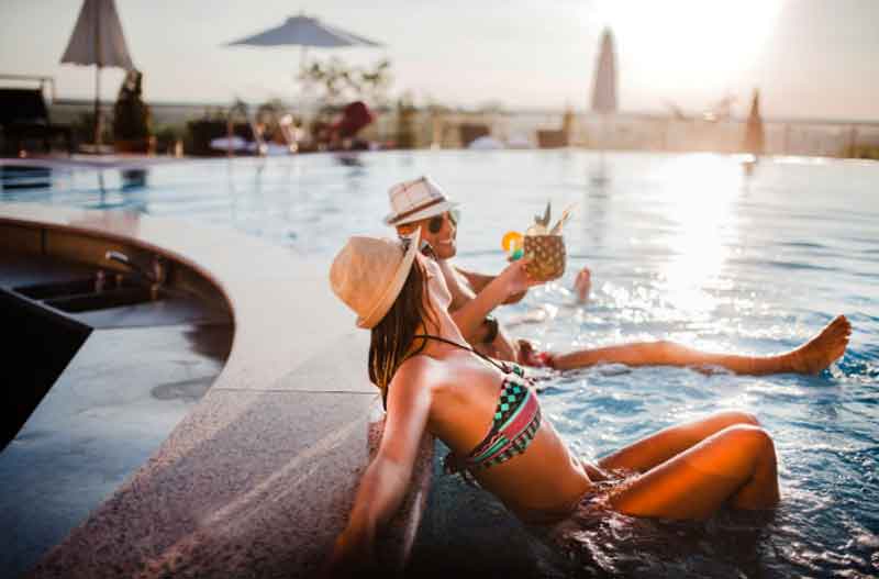 Couple relaxing by the hotel pool