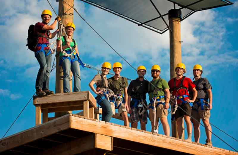 Friends gather at a zipline