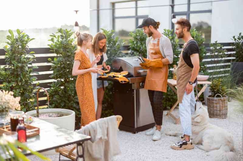 Friends grilling together