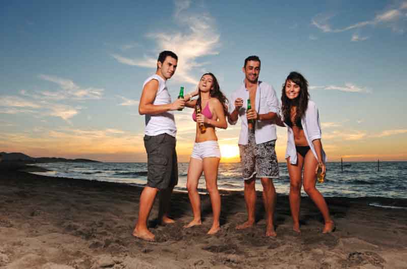 Friends partying at the beach