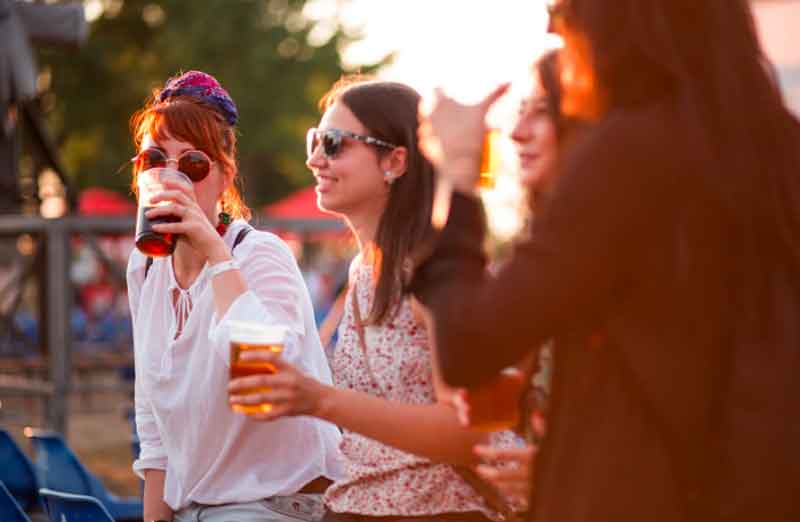 Friends tasting beer at a brewery tour