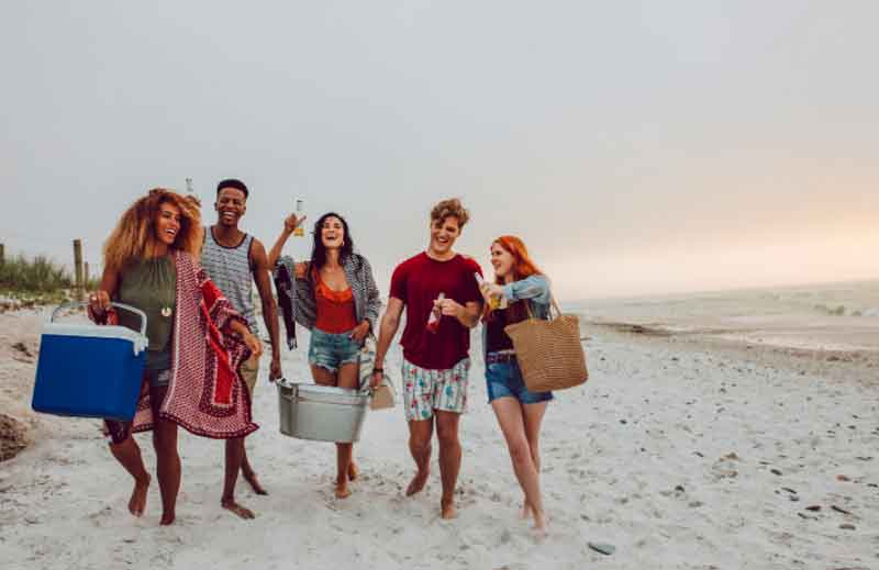 Friends walking on a sandy beach