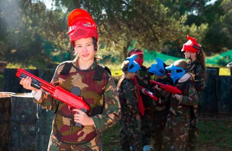 Girl holding a paintball gun