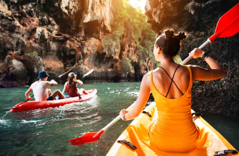 Girl kayaking in beautiful scenery