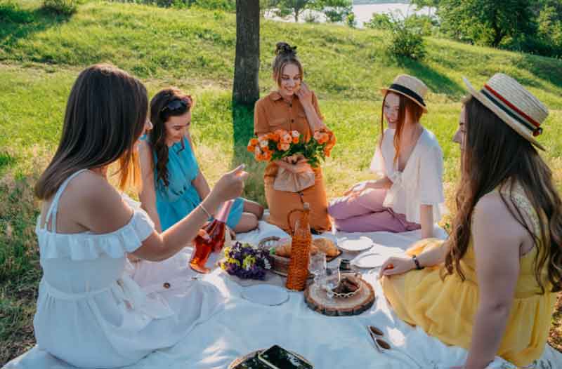 Girls at an outdoor picnic