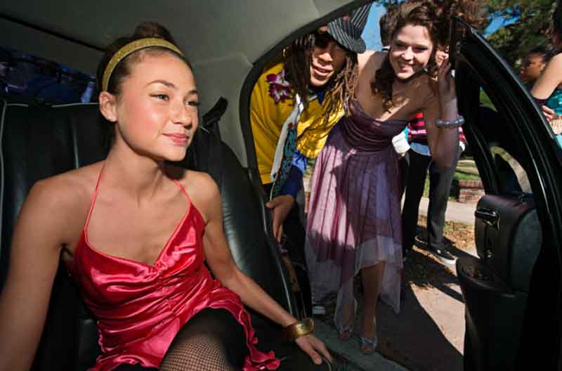 Girls entering limousine