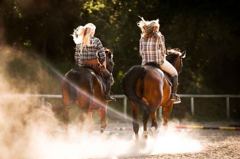 Girls horseback riding