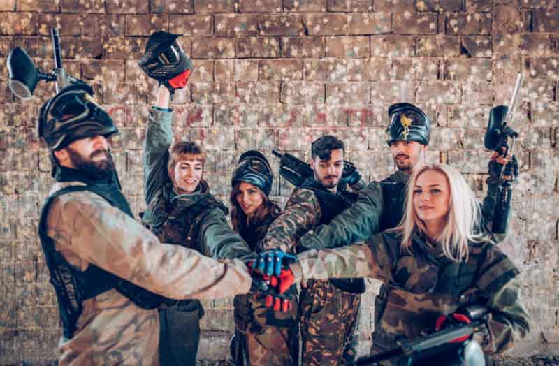 Group of players at a paintball match