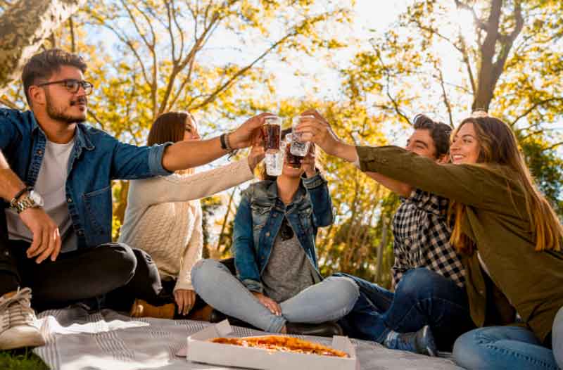 Guys and girls at a picnic