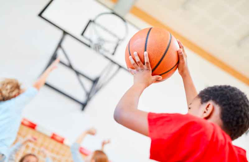 Kid playing basketball