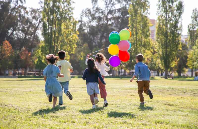 Kids having a birthday party at a park