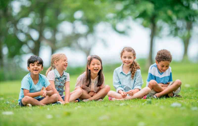 Kids laughing at a park