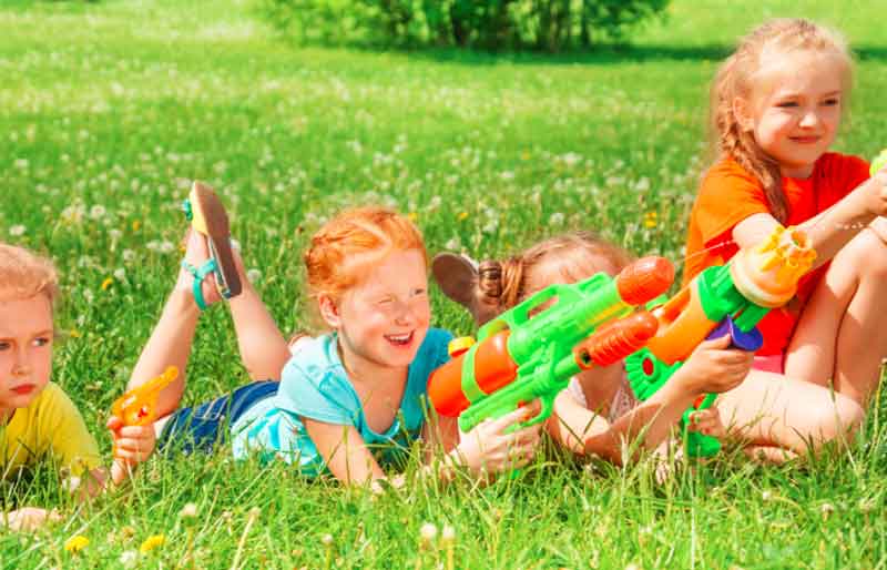 Kids playing with water toys