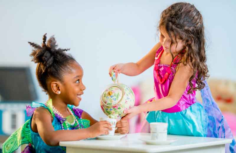 Two girls having a tea party