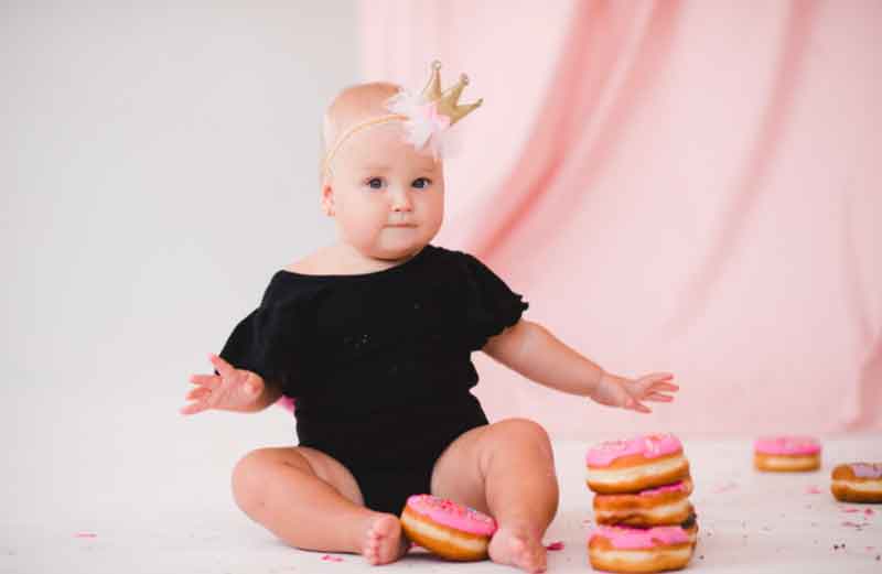 1-year-old with donuts