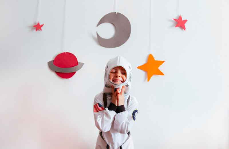Child wearing a space-theme costume