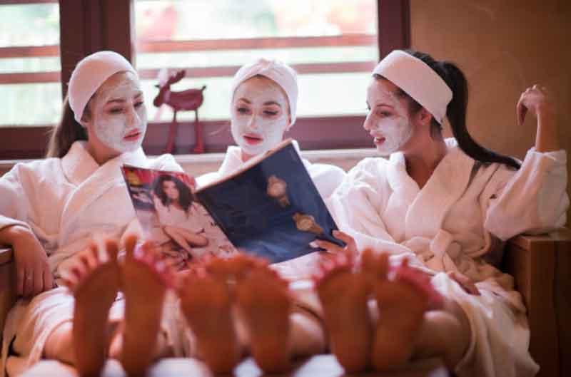 Girls reading at the spa