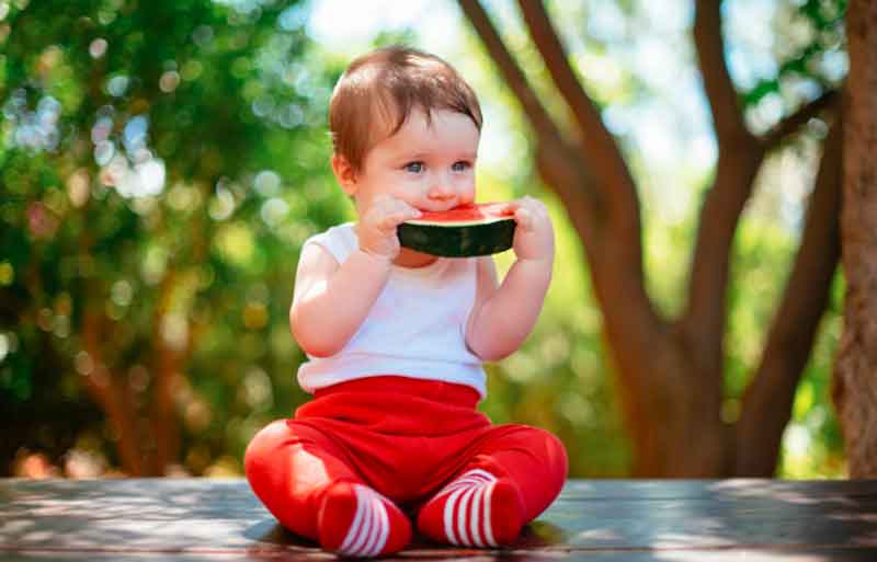 Kid eating watermelon