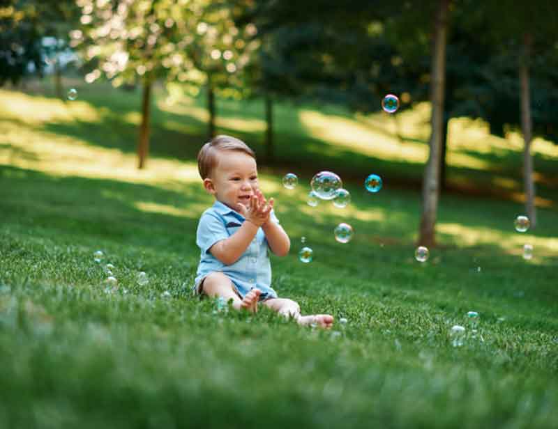 Kid playing with bubbles