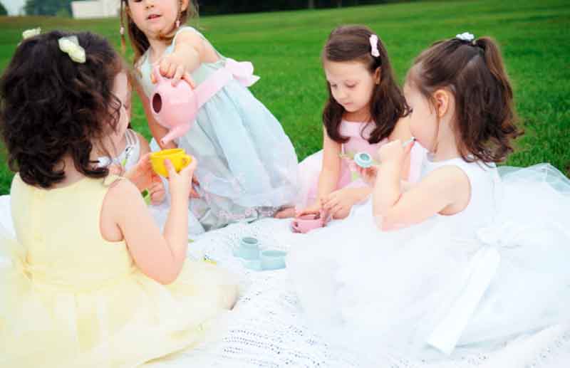 Young girls having a tea party