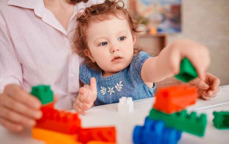 Young kid playing with blocks